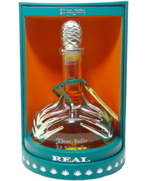 Elegant bottle of Don Julio Real Extra Añejo Tequila 750ml, displaying its deep amber hue through clear glass. The luxurious label confirms its premium 'Extra Añejo' status, set against a subtly textured background, emphasizing its high-end appeal.