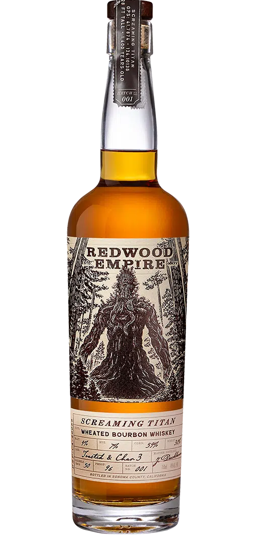 Image of Redwood Empire Screaming Titan Wheated Bourbon 750ml bottle. The sleek, dark glass bottle features elegant gold lettering and a distinctive label depicting a serene California landscape, emphasizing its smooth, wheated bourbon character.